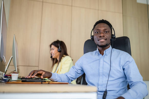 istock Young real estate agents providing customer support in a modern call center environment 2203449404