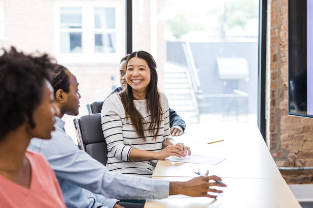 istock Happy Diverse Team Meeting in Modern Office Space 2203450042