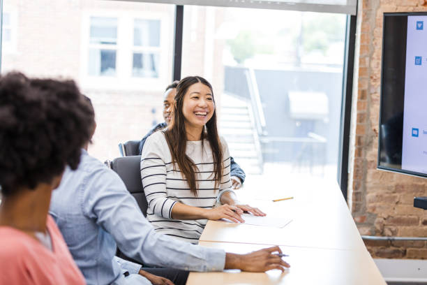 istock Happy Diverse Group Meeting in Modern Office 2203450052