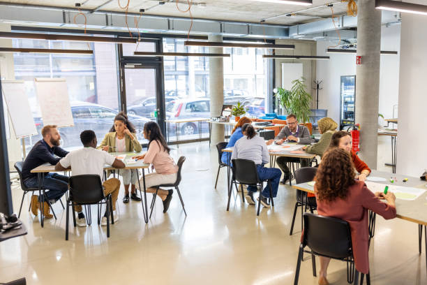 istock Diverse business professionals collaborating in seminar activities 2203451386