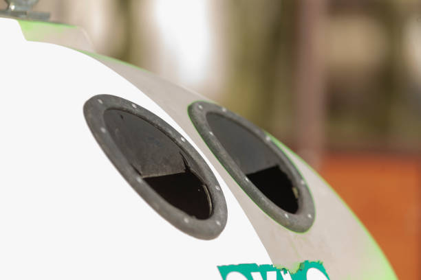 istock A green and white recycling bin featuring two distinct holes in it 2203451896
