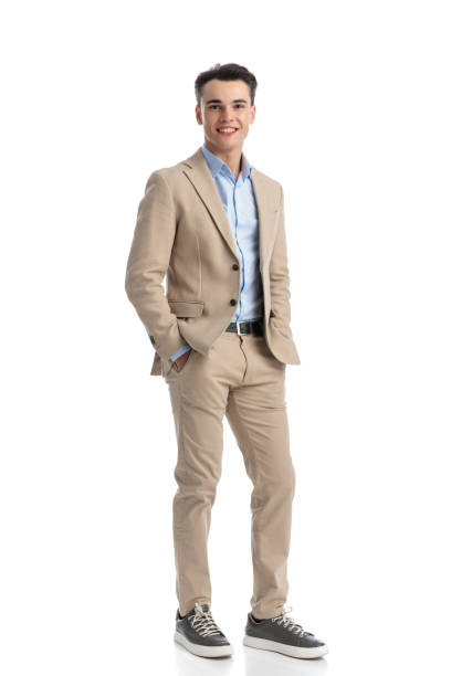istock relaxed smart casual man standing and holding pockets 2203452554