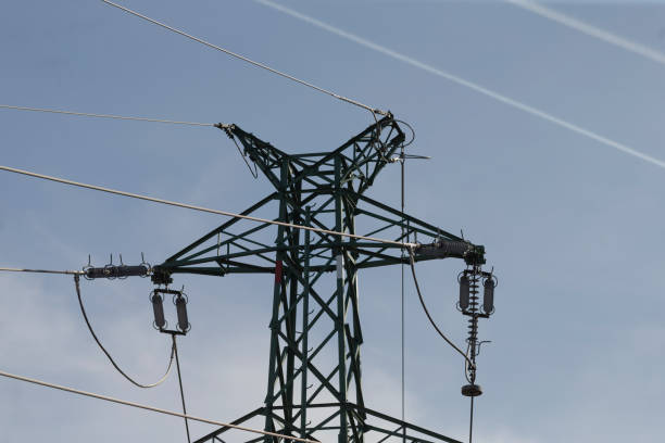 istock A tall telephone pole stands against a bright blue sky 2203455444