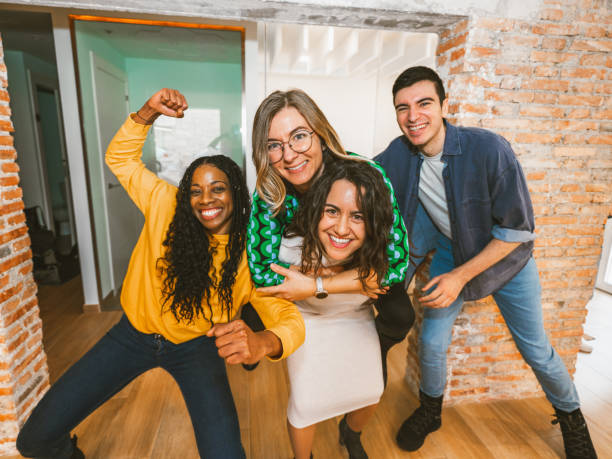 istock Energetic group of professionals celebrating teamwork 2203456091