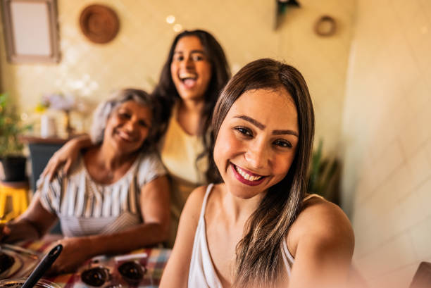 istock Family taking a selfie while making chocolate eggs during the Easter holiday at home 2203456387