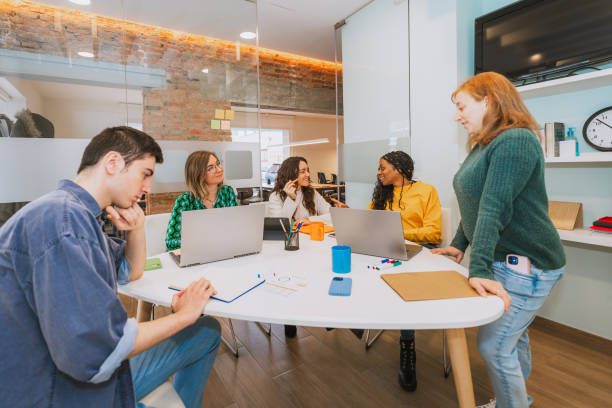 istock Diverse Team Engaged in a Collaborative Office Meeting 2203456520
