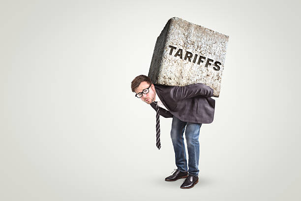 istock Person struggling under the negative impact of tariffs 2203456603