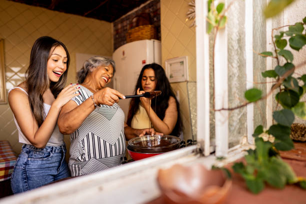 istock Family melting chocolate at home 2203456715