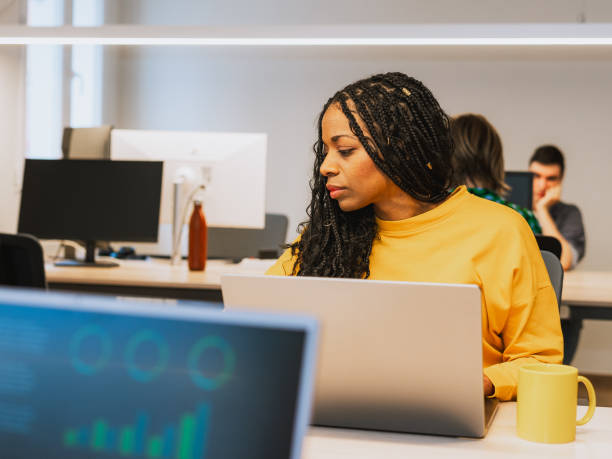 istock Focused Professional Working in a Modern Coworking Space 2203457114