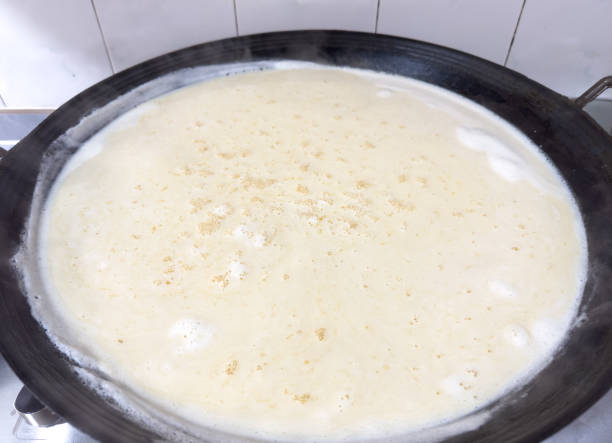 istock Traditional Tofu-Making Process with Fresh Soy Milk 2203458156