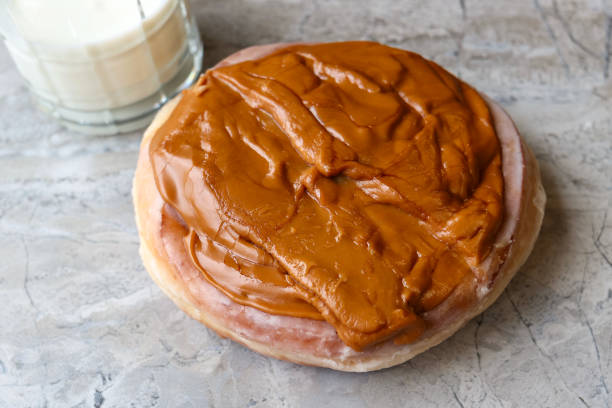Caramel Donut With A Glass Of Milk On A Table