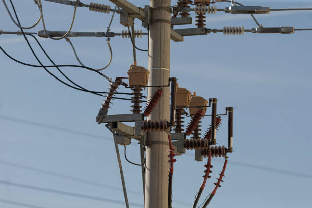 istock A tall telephone pole with numerous wires and cables attached to it 2203460639