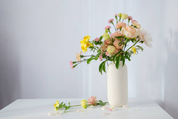 istock beautiful bouquet in white vase in sunlight 2203461422