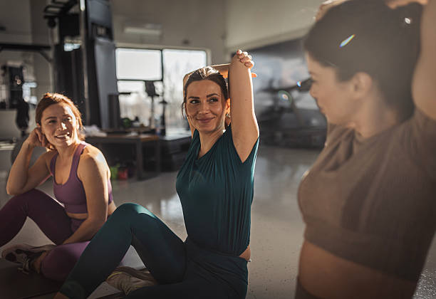 istock Friends warming up together in a gym before a workout session 2203462074