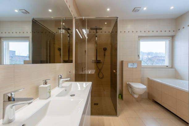 istock Modern Bathroom Interior with Glass Shower and Elegant Fixtures Featuring Natural Light 2203463620
