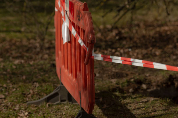 istock There is a red and white fence that has a red and white tape around it 2203465217