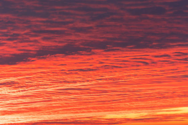 Beautiful orange red cloudy sky during sunset.