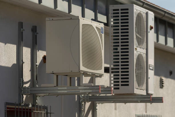 istock There are two air conditioning units mounted on the side of a building 2203470859