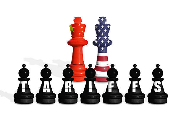 istock Chess made from US and China flags on a white background with word TARIFFS 2203475317