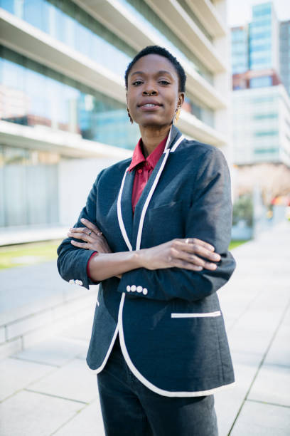istock Confident businesswoman standing outdoors in urban setting 2203480851