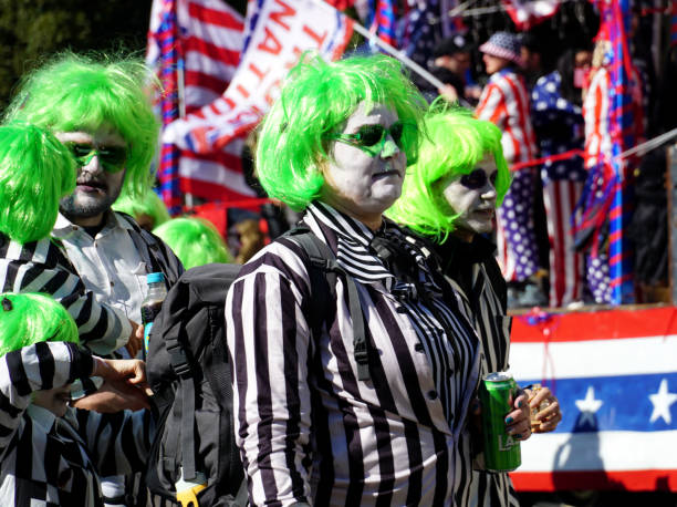 Rijeka, Croatia, March 2nd, 2025. People dressed in Beetlejuice costumes with green wig walk in a carnival parade