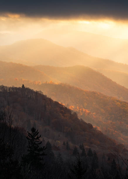 istock Light rays shining down on autumn colored ridges in the great smoky mountains 2203481906