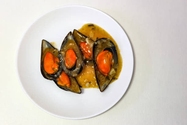 Top view.  Mussel plate on white background.