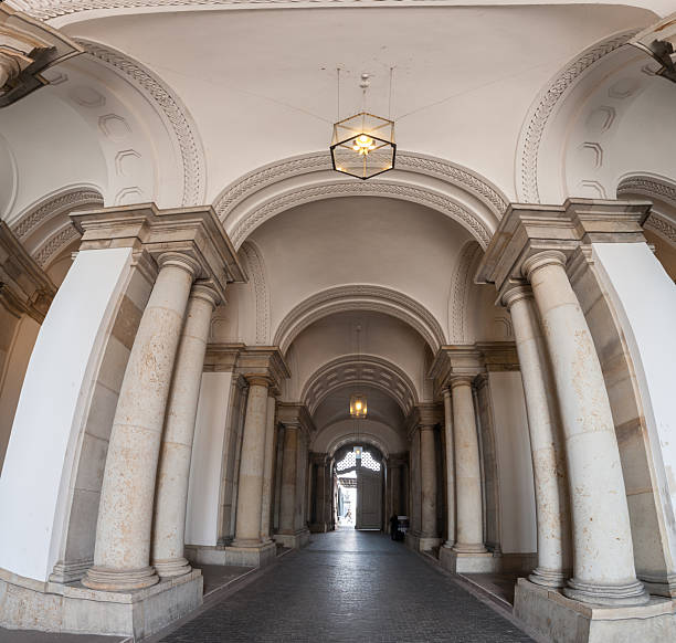 istock grand archway corridor with stone columns.. 2203484413