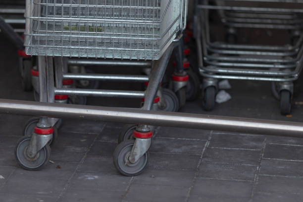 istock Shopping carts are lined up next to each other on the sidewalk 2203487122