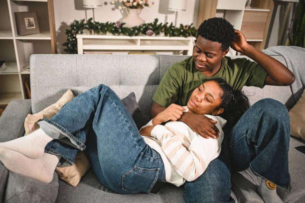 istock young couple on a date, sitting on the couch 2203491510