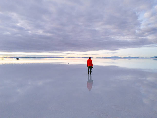 istock Photographer in Red Jacket at Salt Flats 2203493788