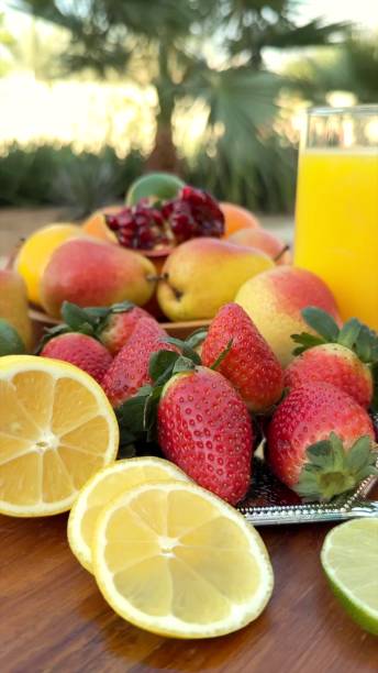 istock Organic fruits arranged with tropical elegance reflect eco-friendly indulgence. Organic citrus , fruits strawberries highlight vibrant organic charm and natural balance. 2203495621