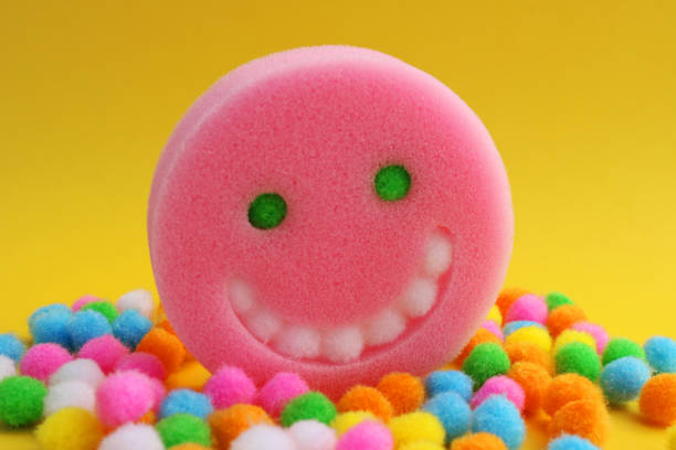 Happiness face surrounded by colorful plush spheres