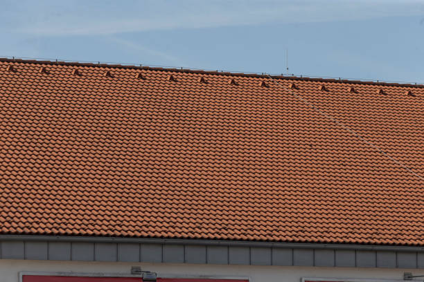 istock A stunning building with a red tiled roof and blue sky backdrop 2203502493