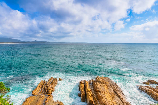 Scenic views over the sea from Sunrise Point next to the Breakwall and Marina in Bermagui, NSW, Australia.