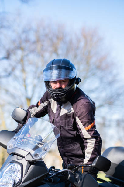 istock Male rider getting on his motorcycle 2203507049