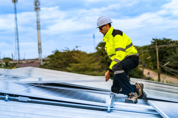 istock technician lifting a photovoltaic panel during installation, showcasing renewable energy advancement. Dressed in safety gear, reflecting a focus on green energy solutions and sustainable development. 2203509212