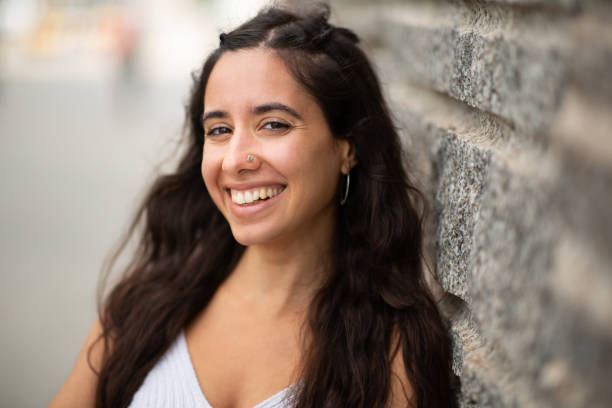 istock Close up smiling beautiful young woman 2203511049