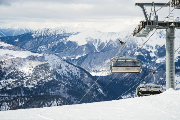 istock Ski resort slope and ski lft. Alpine ski / snowboard vacation. 2203511131