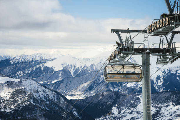 istock Ski resort slope and ski lft. Alpine ski / snowboard vacation. 2203511156