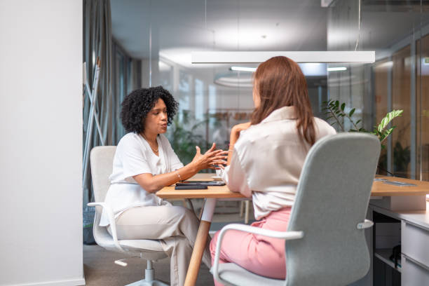 istock Diverse Businesswomen Engaging in Teamwork at Office 2203511864