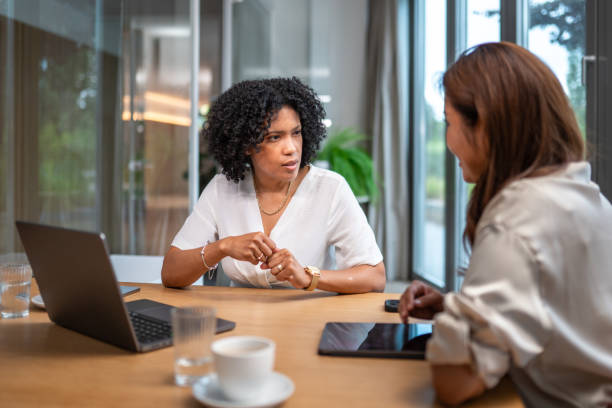 istock Diverse Businesswomen Collaborating at Office Desk 2203511903