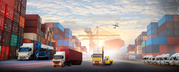 istock forklift handling container box loading to truck in import export logistic, Business logistics concept 2203519356