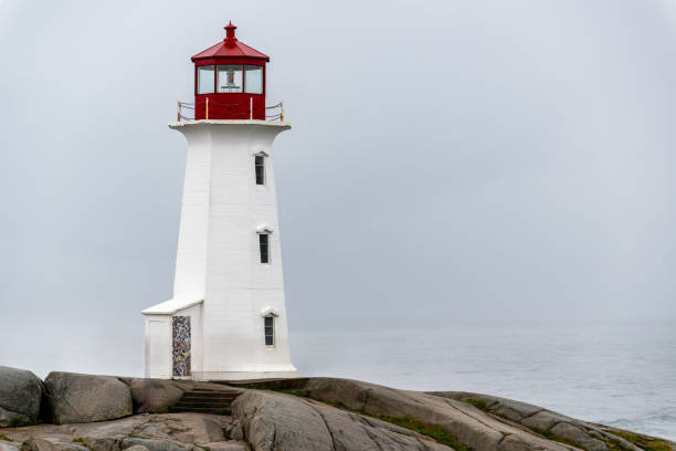 istock Foggy day at the Peggy's Cove lighthouse 2203520899
