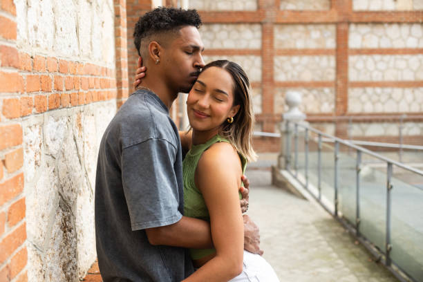 istock Young couple sharing a tender moment in urban setting 2203521432