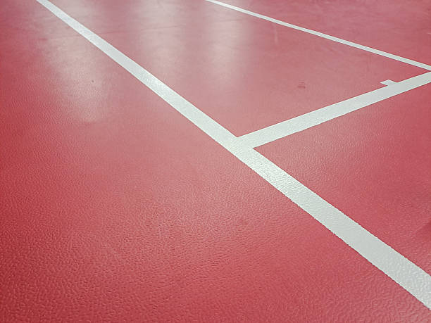 istock A white badminton shuttlecock lies on a red court 2203521996