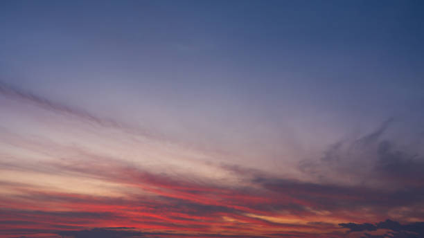 istock Majestic sunrise sky background with gentle colorful clouds 2203523739