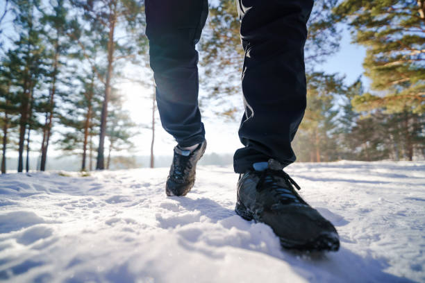 istock person walking on snow 2203527279