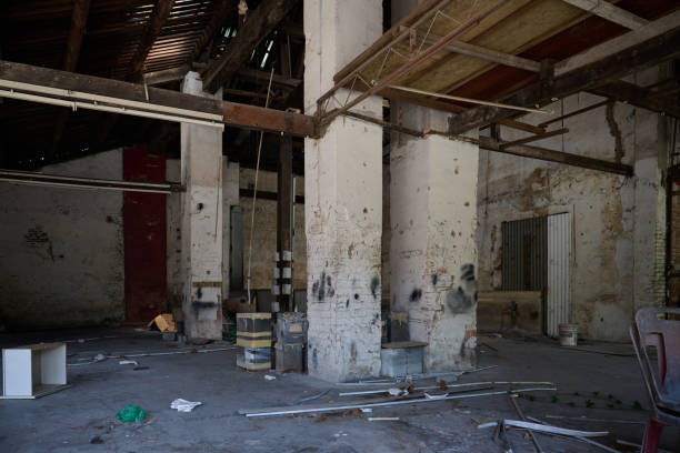 istock Abandoned Warehouse with Standing Pillars and Scattered Debris 2203529230