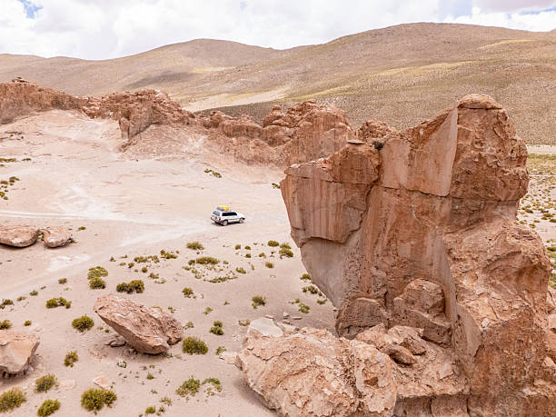 istock Remote SUV Adventure on Rocky Desert Terrain 2203530303